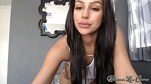 Amateur girl Briana Lee shows off her tattoos and big tits in solo video